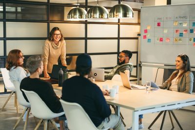 Creative business team: Boardroom brainstorming with a scrum master